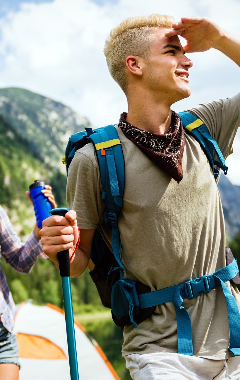 Group of happy hiker friends trekking as part of healthy lifestyle outdoors activity