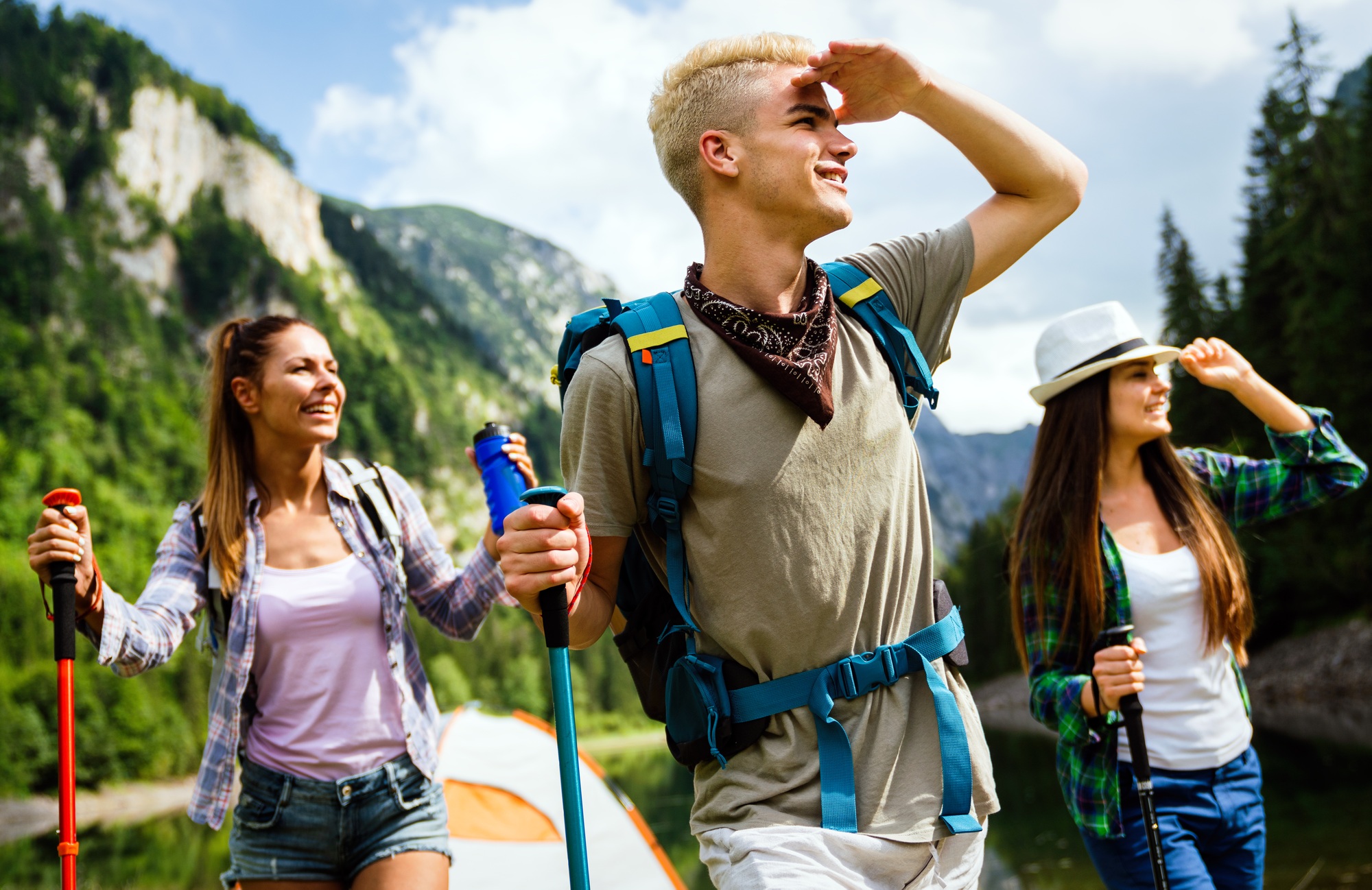 Group of happy hiker friends trekking as part of healthy lifestyle outdoors activity